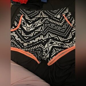 No Boundaries Monochrome Geometric Shorts with Orange Accent